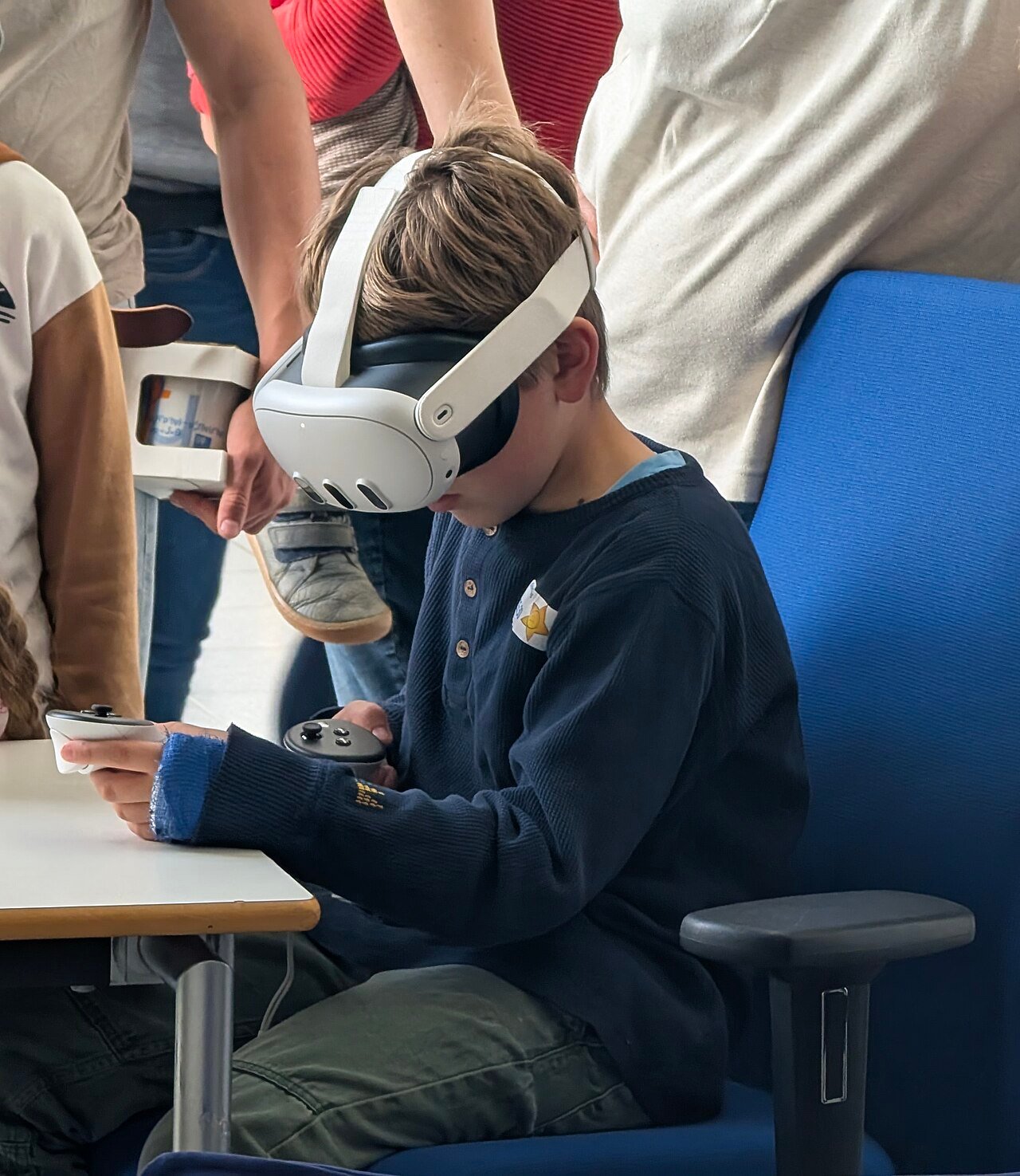 Person standing while using a Meta Quest 3 VR headset, illustrating active VR sports and fitness
